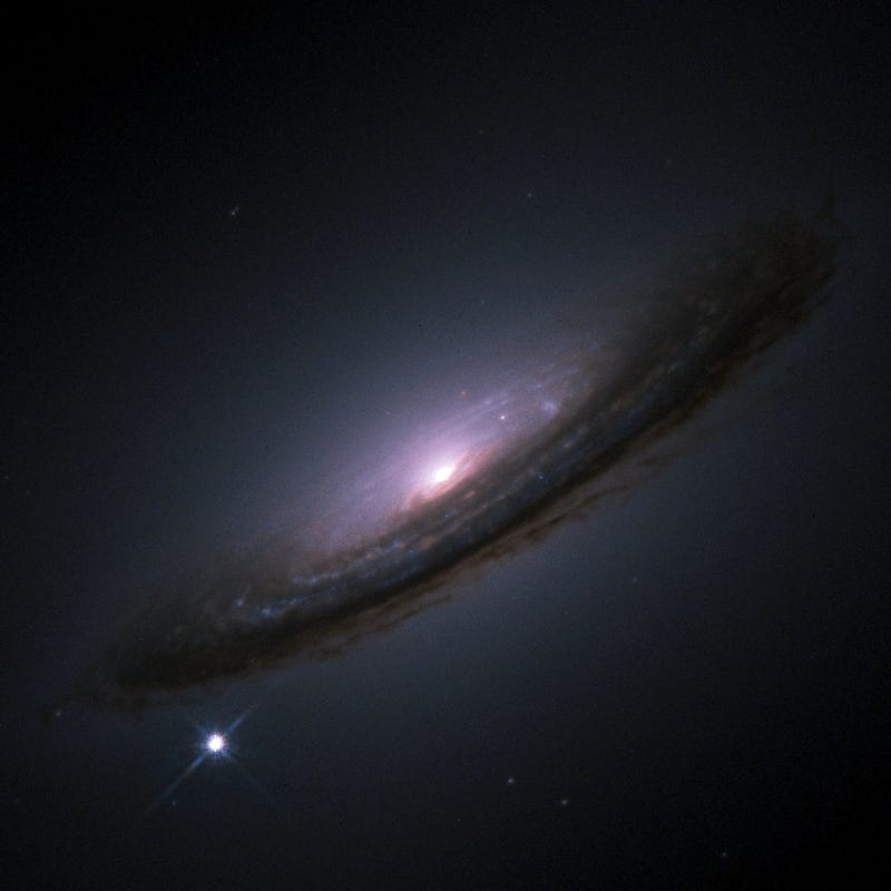 A type 1a supernova momentarily outshining a galaxy.