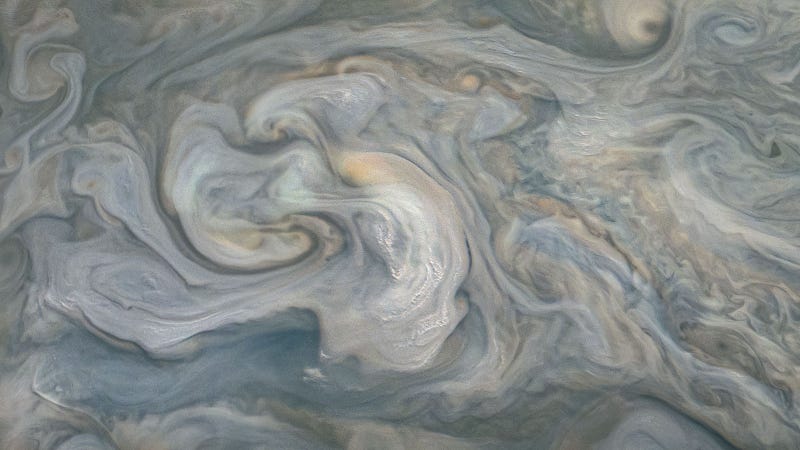 Bright clouds over Jupiter indicating storm activity