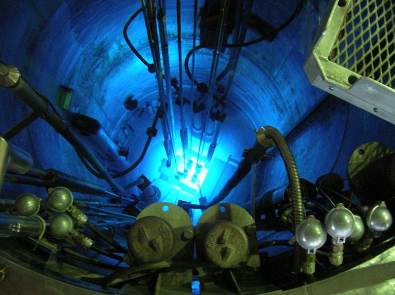 Inside a nuclear reactor emitting Cherenkov radiation.